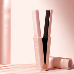 Pink compact hair styling wand for women with sleek design and removable cap