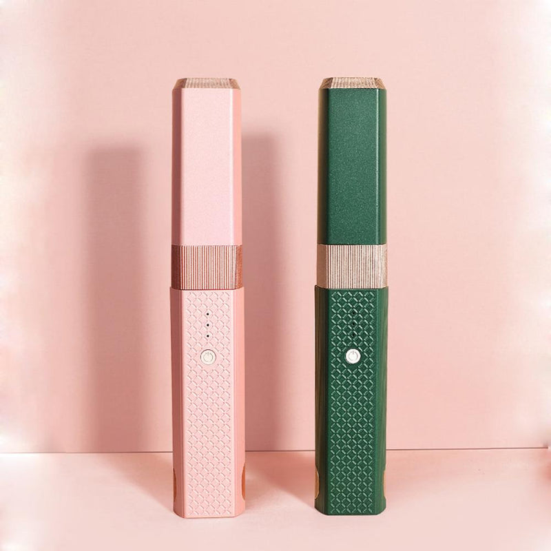 Pink and green hair styling wand for women with textured grip and sleek design