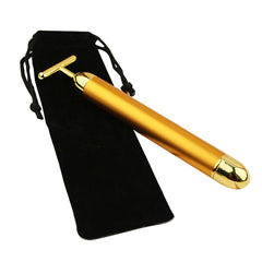 24k gold facial roller with sleek gold handle and black velvet storage pouch