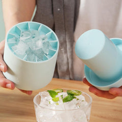 Portable silicone ice maker bucket in light blue making clear ice cubes for drinks