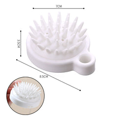 White soft silicone dog brush with multiple flexible bristles and a small handle for easy grip