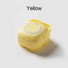 Yellow soft silicone dog brush with a smiley face design and handle for easy grooming